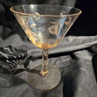 Pink etched Depression glass champagne coupe with floral and paneled design