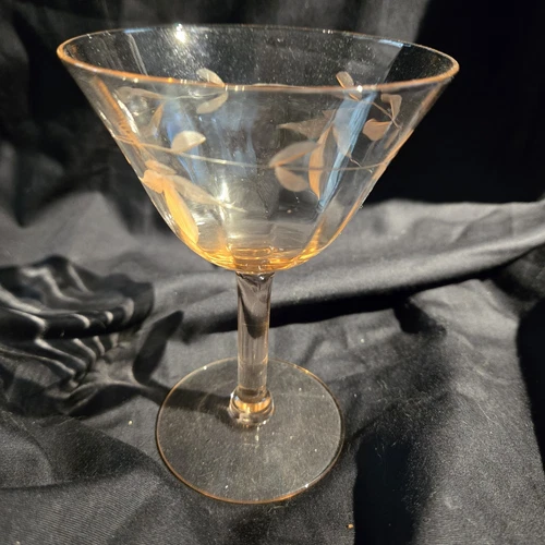 Pink etched Depression glass champagne coupe with floral and paneled design