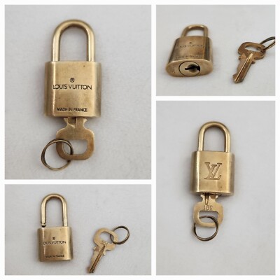 Louis Vuitton Lock And Key Set, Stamped, Numbered,Authentic #301