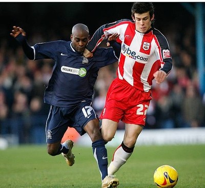 Gareth Bale of Southampton is tackled by Jamal Campbell-Ryce of So- Old Photo