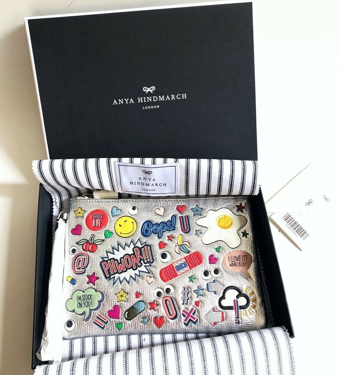 Anya Hindmarch Stickers embellished leather wristlet $495 +