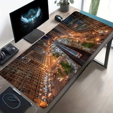 A Large Electronic Sports Gaming Mouse Pad Featuring a Vibrant City Night Scene