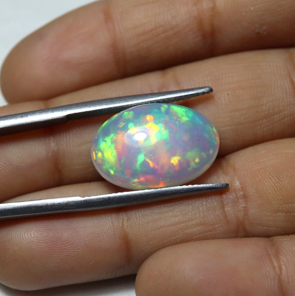9,1 quilates 18,3 x 12,3 mm natural AAA llamativo multi fuego ópalo etíope cabujón ovalado Foto 2 de 4
