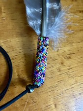 Peyote beaded smudge feather with yellow or red cedar smudge.