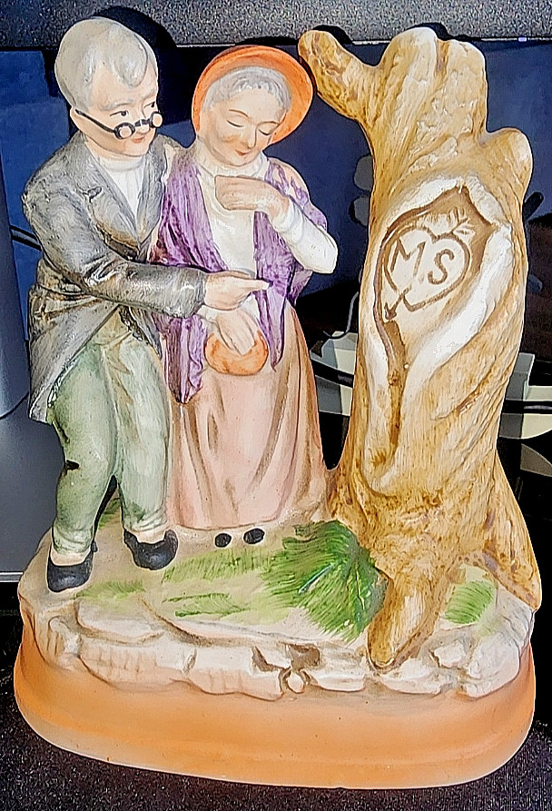 Hand-painted porcelain spinning couple under a tree — a genuine SANKYO Japan mechanism makes this a collector-grade vintage piece, not a trinket.