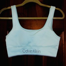 Calvin Klein Women's Seamless Ribbed Medium Impact Sports Bra in a light blue.