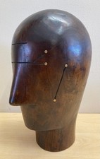 A HEAVY DARK WOOD BRASS STUDDED FRENCH STYLE MILLINERS HAT BLOCK