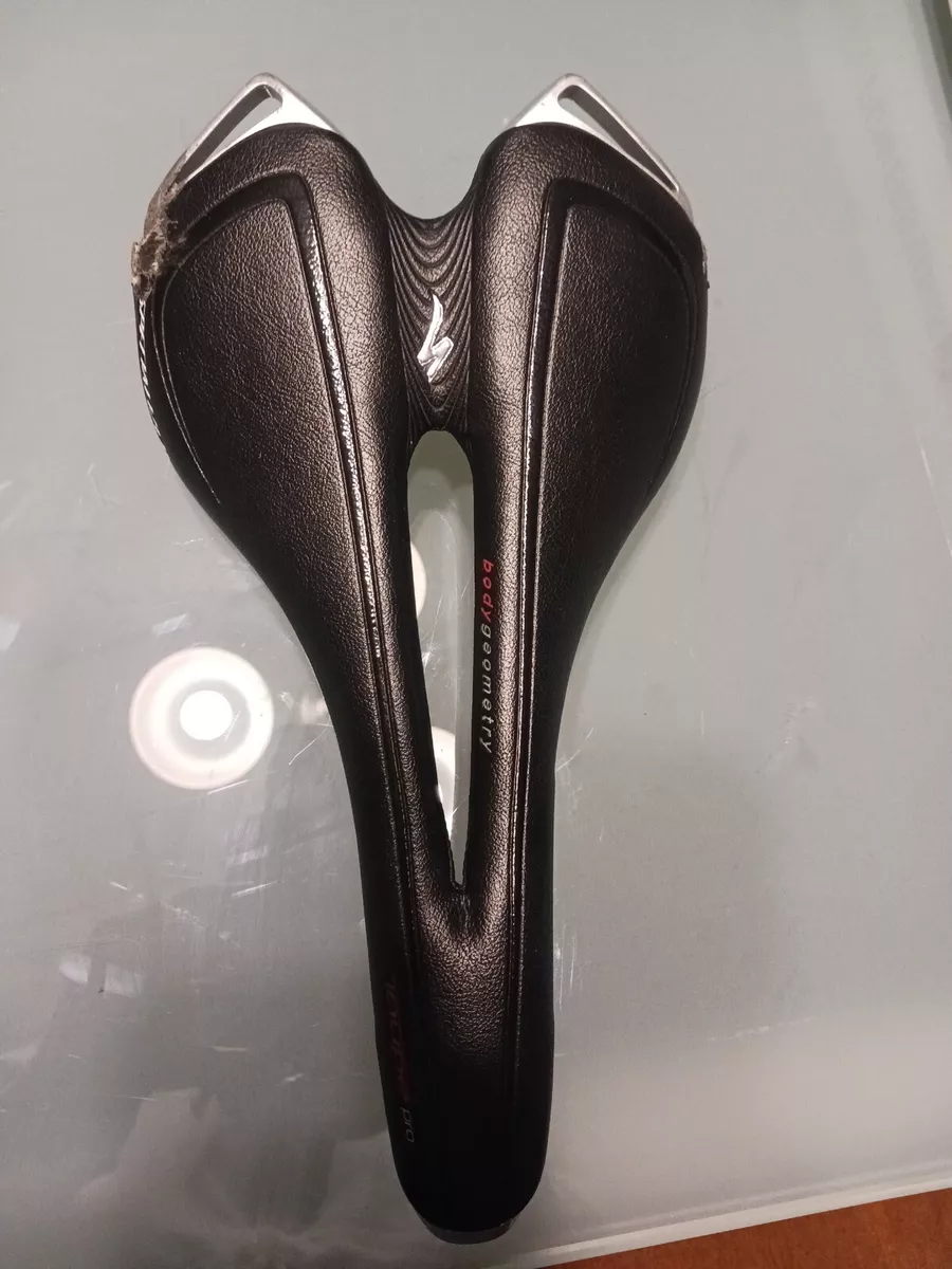 130g Specialized Toupe Pro Saddle Carbon Rails 143mm size. Some road rash
