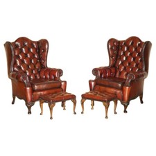 PAIR OF CHESTERFIELD VINTAGE OXBLOOD LEATHER WINGBACK ARMCHAIRS & FOOTSTOOLS