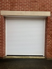White Single Aluminium Insulated Electric Roller Garage door made in UK.