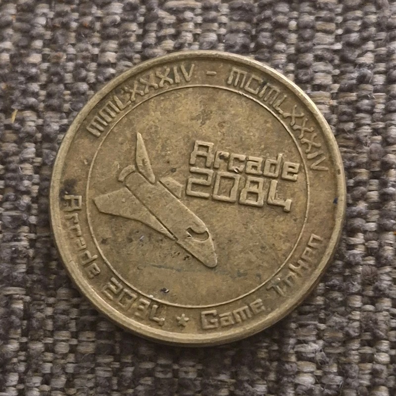 Arcade 2084 Collectible Game Tokens Roman Numerals Arcade Machine Spaceship