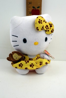 Ty Beanie Baby Hello Kitty in Yellow Paw Print Dress Holding a Monkey