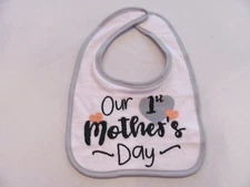 NWOT BABY UNISEX WHITE W/ GRAY TRIM "OUR 1ST MOTHER'S DAY" BIB