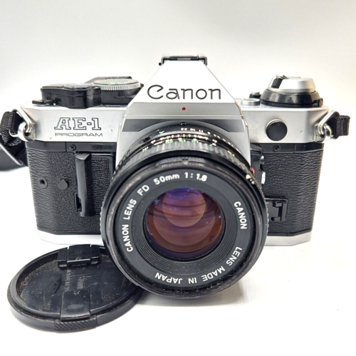 Appareil photo reflex argentique 35 mm programme Canon AE-1 avec kit d'objectif 50 mm, testé et fonctionnel ! - Photo 1 sur 5