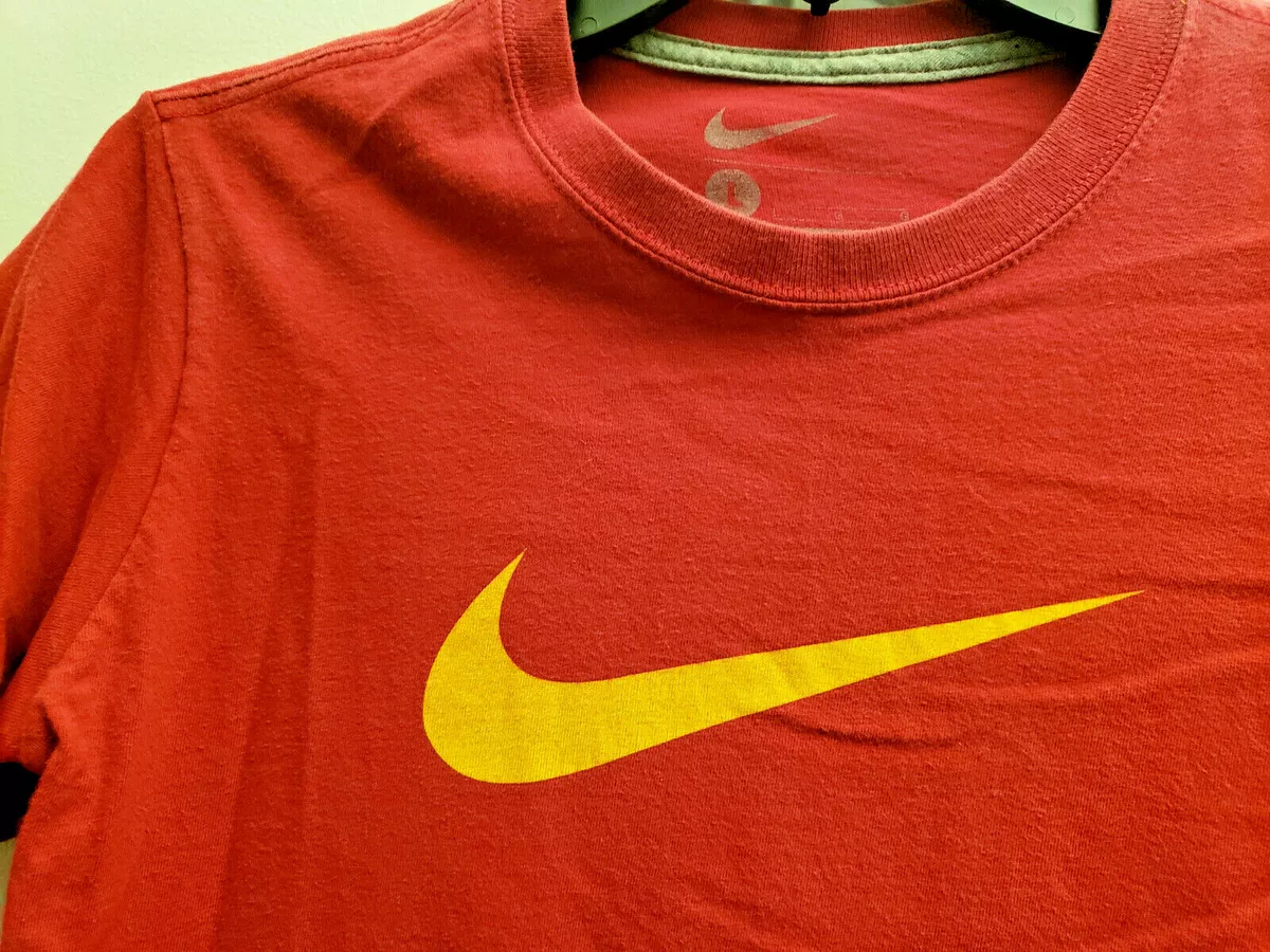 yellow and red nike shirt