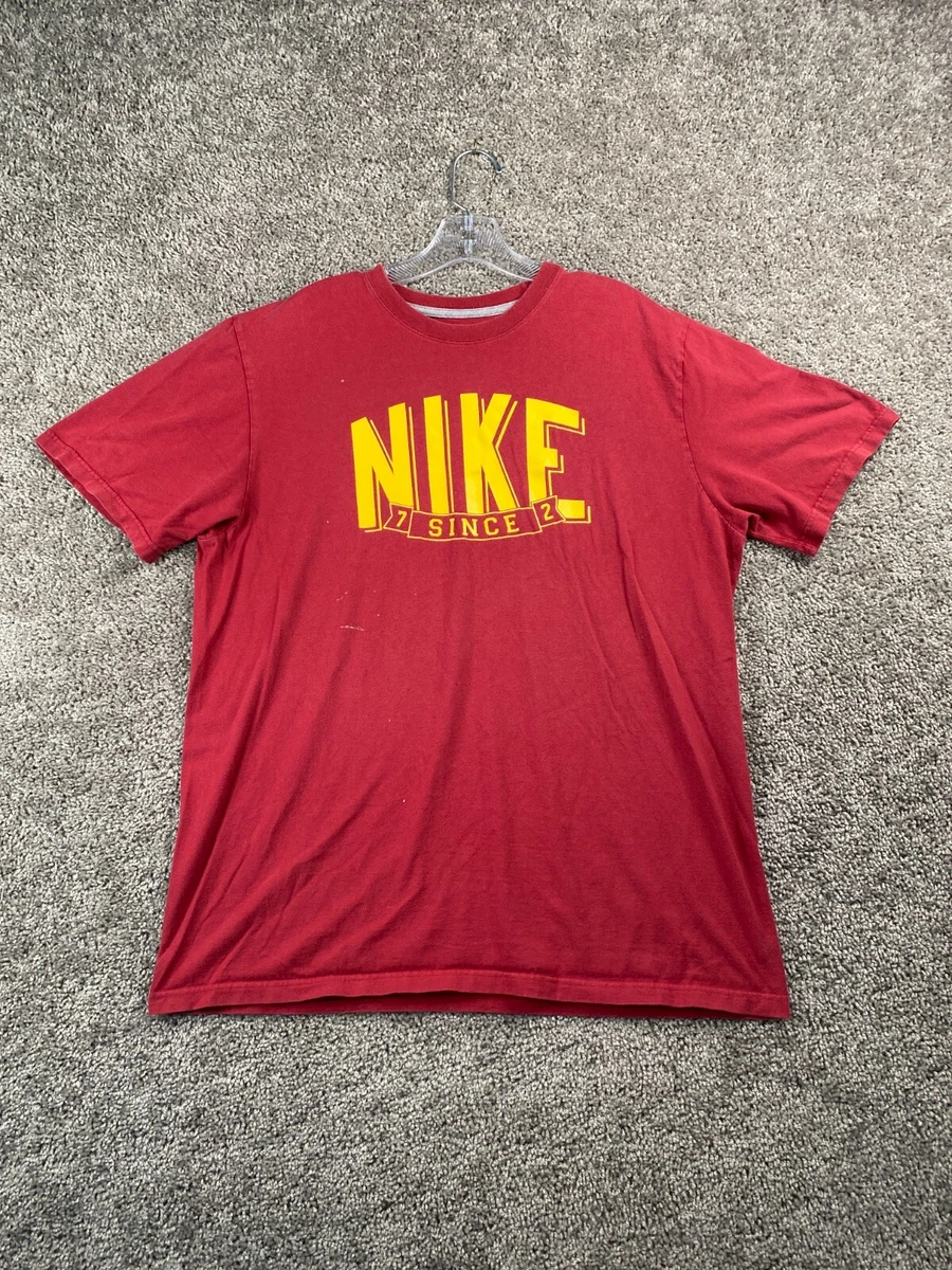 yellow and red nike shirt