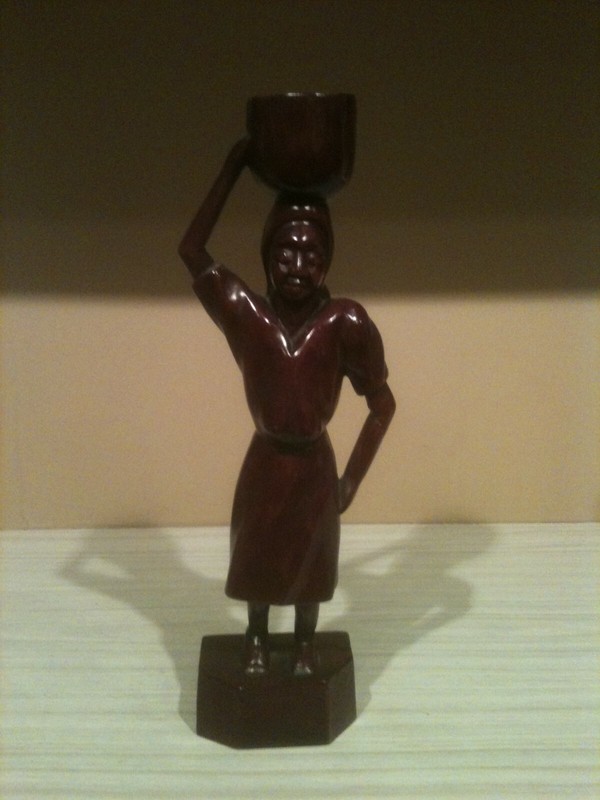 African Art -Female carrying an item