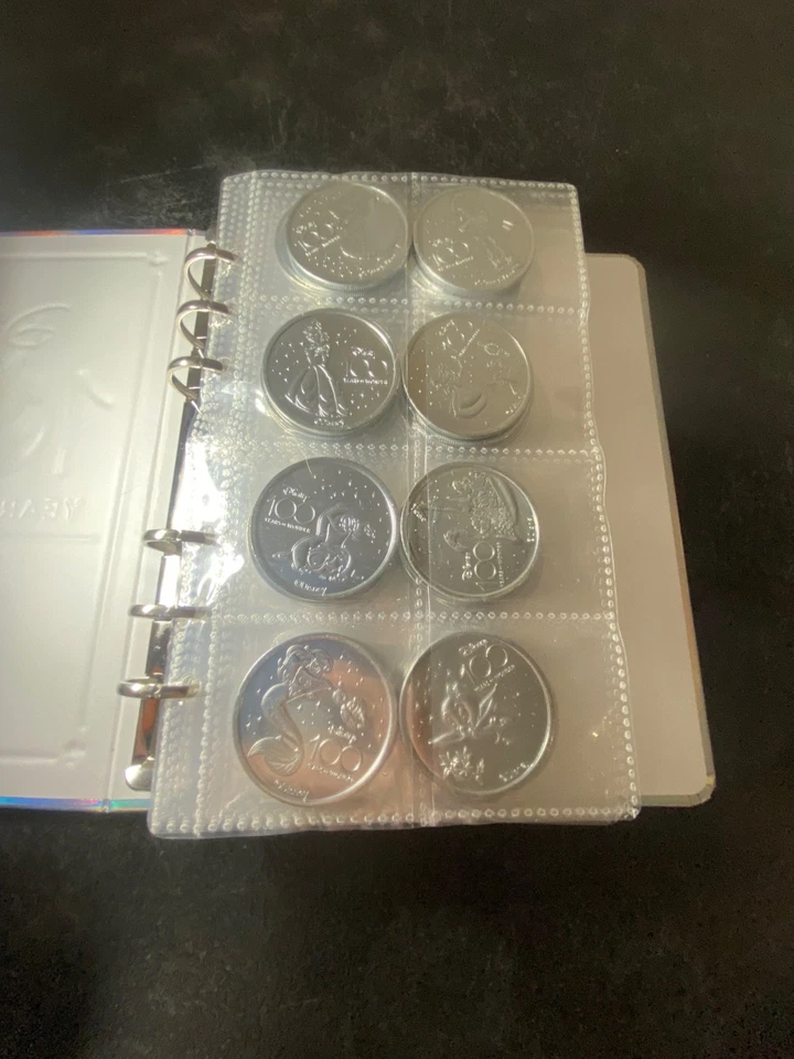 Disney 100 Years of Wonder 70 Medallion Coins w/ 2 Bonus Pirates Coins EXCELLENT - Image 2 of 4