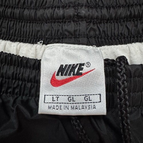 Giacca a vento vintage Nike Joggers nera swoosh uomo taglia L pantaloni alti alla caviglia con zip - Foto 2 di 10