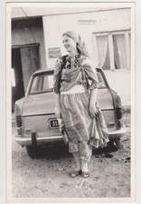 Graceful Young Woman Standing Lightly With Open Smile Carrying Ease Into The Day