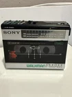 Sony Walkman WM-F15 with belt clip. FOR PARTS ONLY .