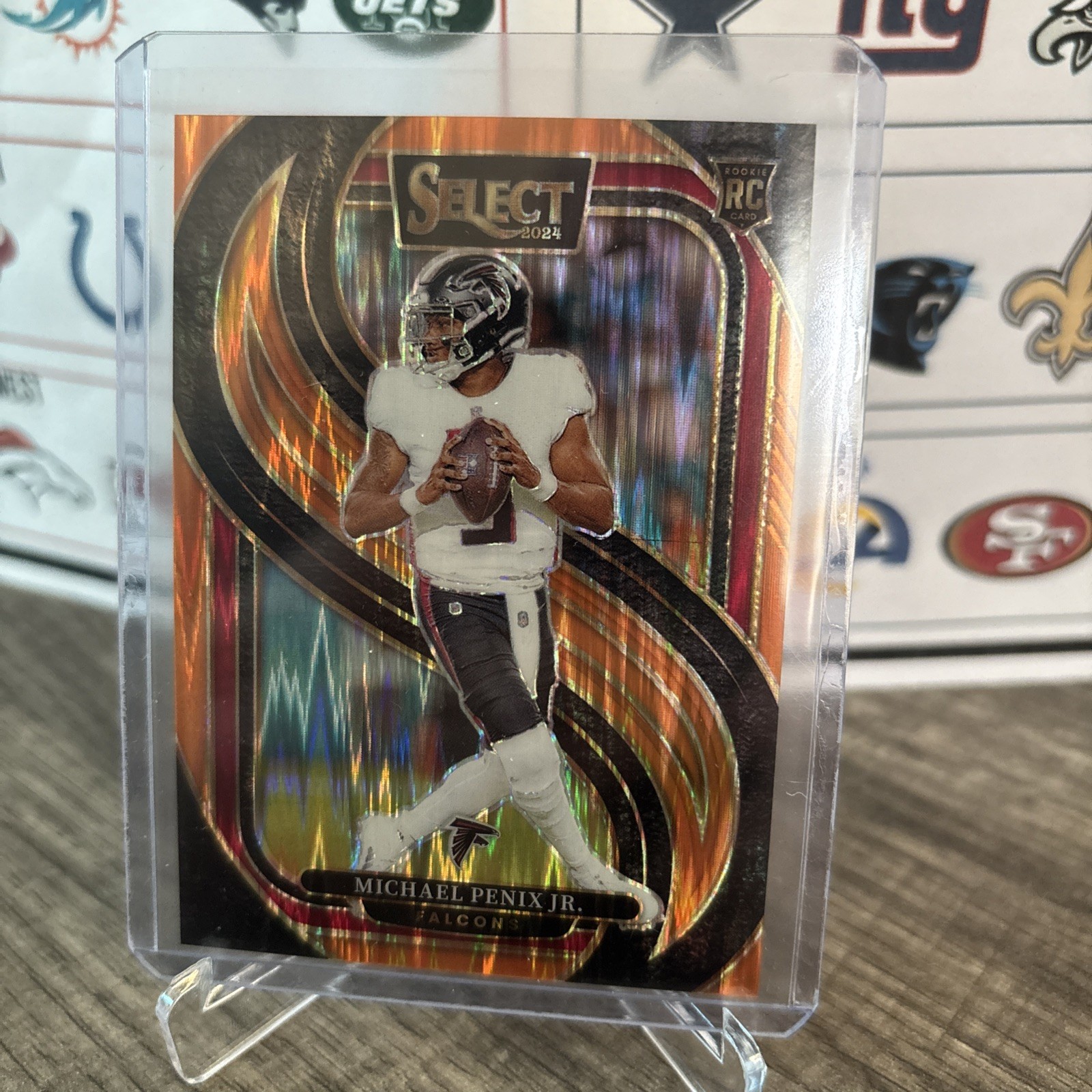 2024 Panini Select - Premier Level Michael Penix Jr. #110 Orange Shock /399 (RC)