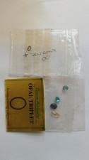 An Interesting Collection Of Loose Gems Including An Opal Triplet And Zircons.