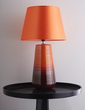 Ceramic table lamps in orange or green glazed finishes with matching lamp shades