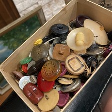 Vintage collection of lucite, Bakelite, metal, fabric, and more sewing Buttons