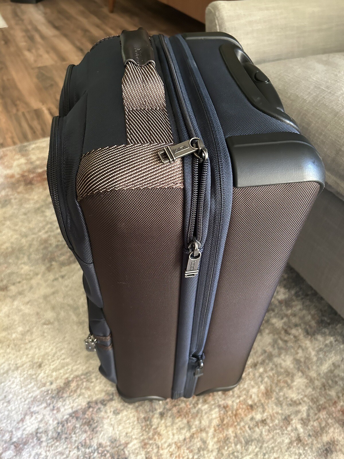 TUMI Briley International Expandable Luggage Rolling Spinner Blue