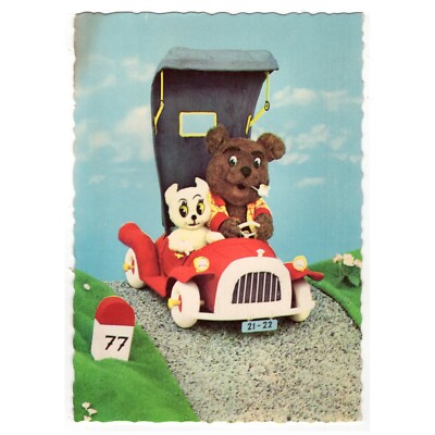 Postcard teddy bear and cat taking a ride in the car