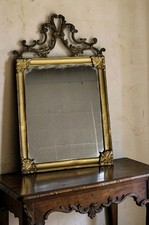 Miroir mural ancien en laiton doré style Louis XV rocaille