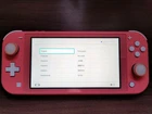 Nintendo Switch Lite Coral Pink Console Bundle with Games, Accessories and Case.