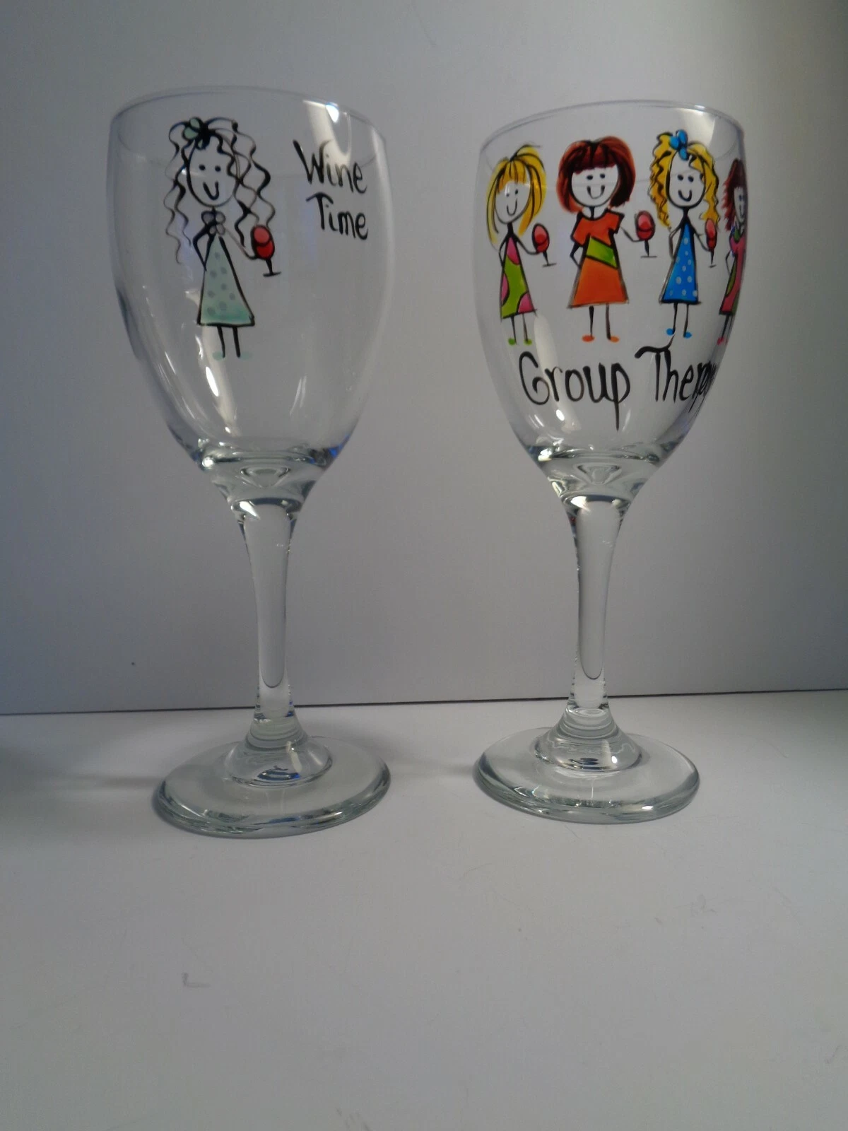 Pair of Clear Embossed Wine Time and Group Therapy Wine Glasses