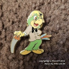Vintage Disney trading pin featuring the character José Carioca, a green parrot