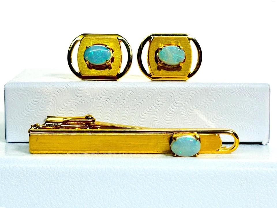 Natural opal cabochons set in gold-tone — the shifting color play makes these cufflinks genuinely eye-catching and one-of-a-kind.
