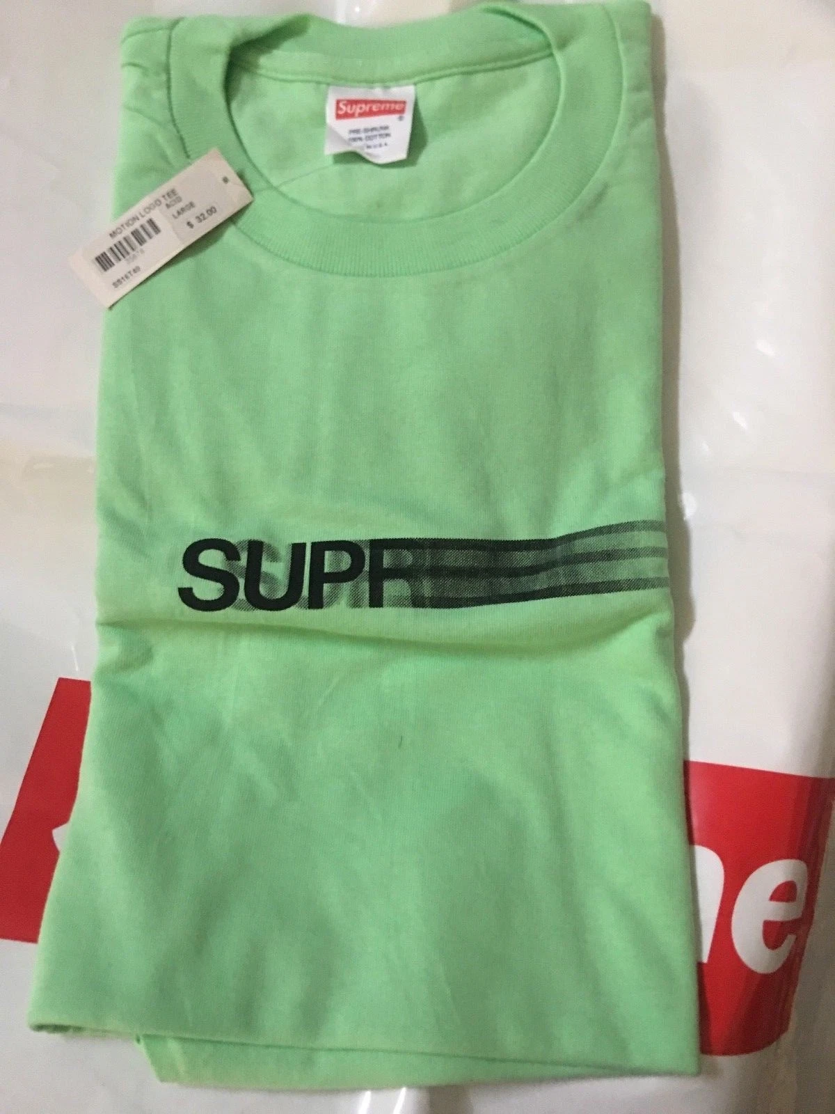 BOÎTE LOGO SUPREME MOTION LOGO TEE ACIDE TAILLE GRAND T SHIRT EN MAIN MAINTENANT 100 %