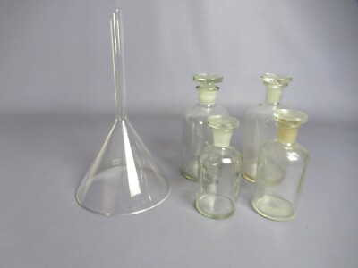 Set Of 4 Pharmacy Bottles And 1 Vintage Glass Funnel From The 1950s