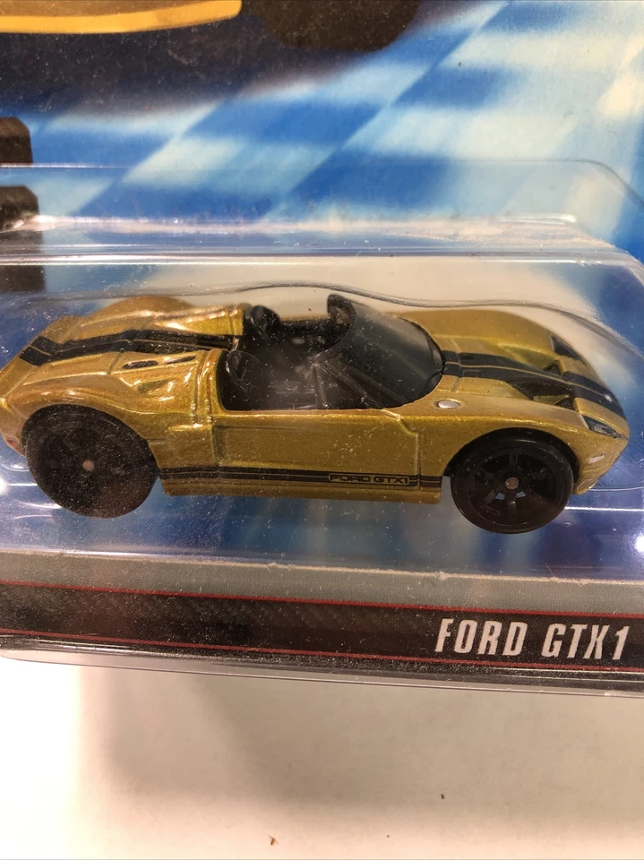 Hot Wheels Speed Machines Ford GTX1 золотистый с черной полосой ̼R8488 - Изображение 2 из 4