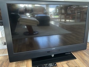 Metz Fernseher Taros 42 Zoll mit Standfuß und Samsung Sound Bar