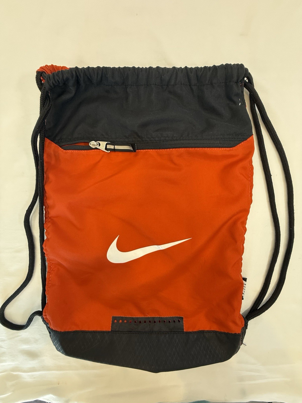 Nike 18 Inch Black Orange Drawstring Backpack with Zip Pocket