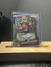 2025 AUTO (RC) Shedeur Sanders Lazer Prizm Refractor Circular Holo Patterns.