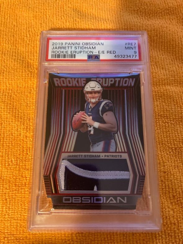 Jarrett Stidham Panini Obsidian Rookie Eruption Materials #RE7 Electric Etch Red