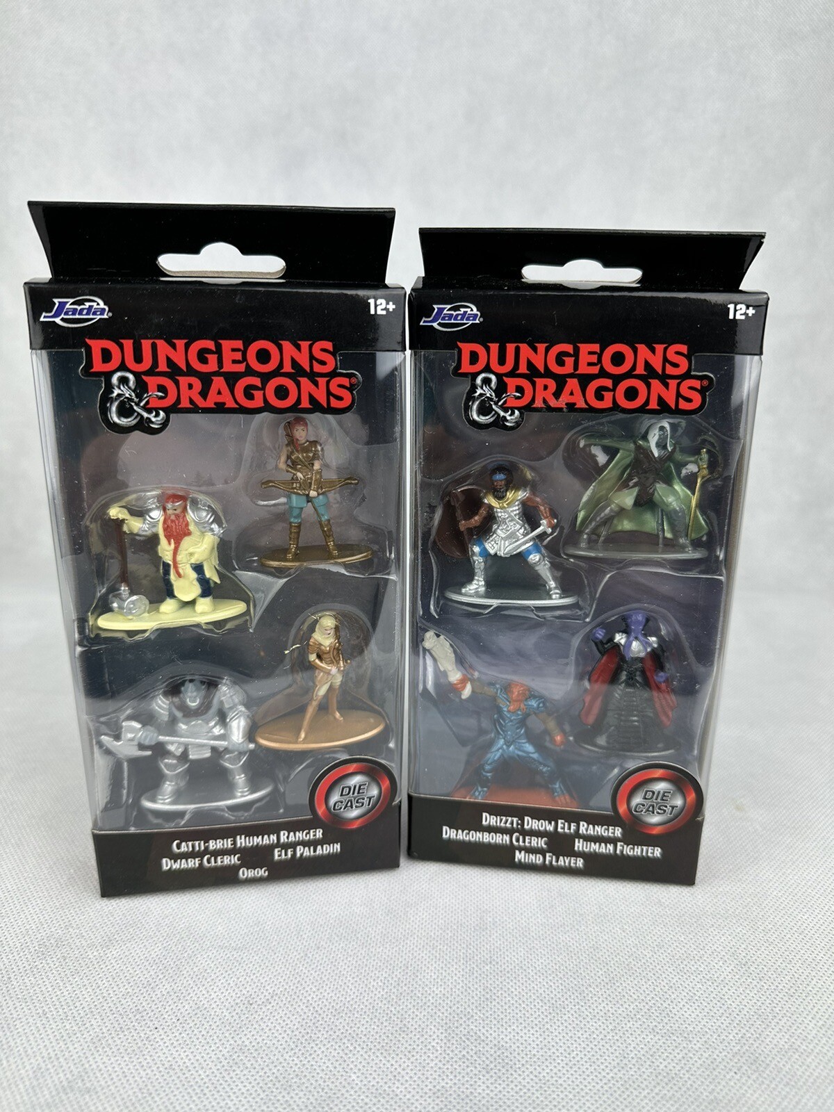 Jada Toys Dungeons and Dragons - Set di personaggi DND (set da 7 personaggi da collezione in 3 dimensioni), in metallo a partire dai 12 anni (Elfo, Barbarian, Nano, Golem, Oger, Beholder