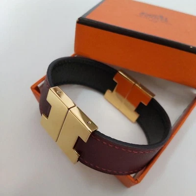 Bracelet Hermès Roulis réversible en cuir bordeaux noir or logo H du Japon - Photo 1/4