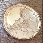 Silver coin with 1 PANDA eating bamboo, 1 Troy OZ, .99 PURE, one hundred panda $