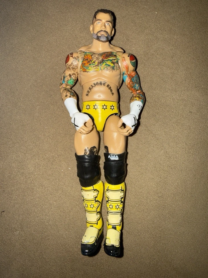 Figura de acción CM Punk WrestleMania 41 MITB Ultimate Edition WWE Mattel Foto 2 de 4