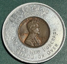 MM JEWELERS OPTOMETRIST SPOKANE ENCASED 1935 PENNY TRADE TOKEN GOOD FOR $1 RARE