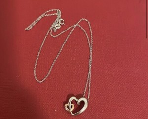 10k white and rose gold heart with small diamond on a 14 k chain