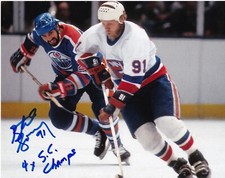 BUTCH GORING  NEW YORK ISLANDERS  4 X STANLEY CUP CHAMPS  ACTION SIGNED 8x10